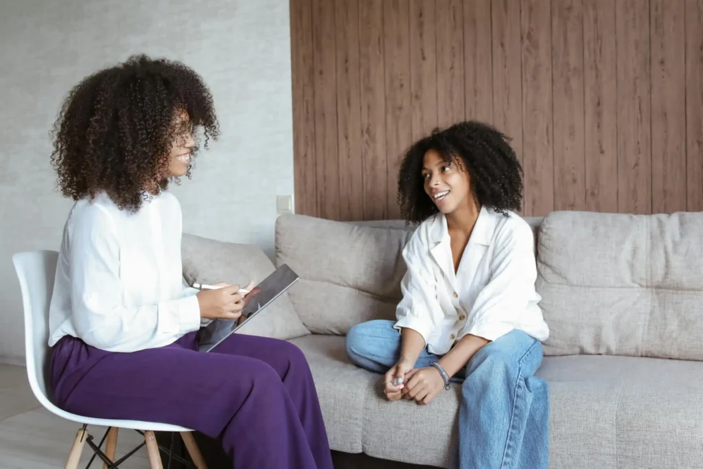 Women Having Conversation at a drug and alcohol detox center while Looking at Each Other