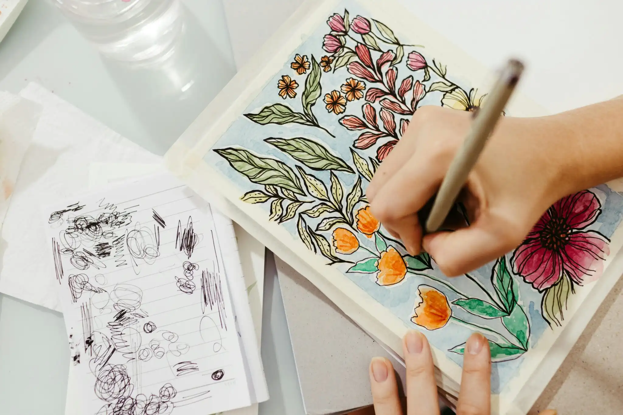 a woman coloring her artwork