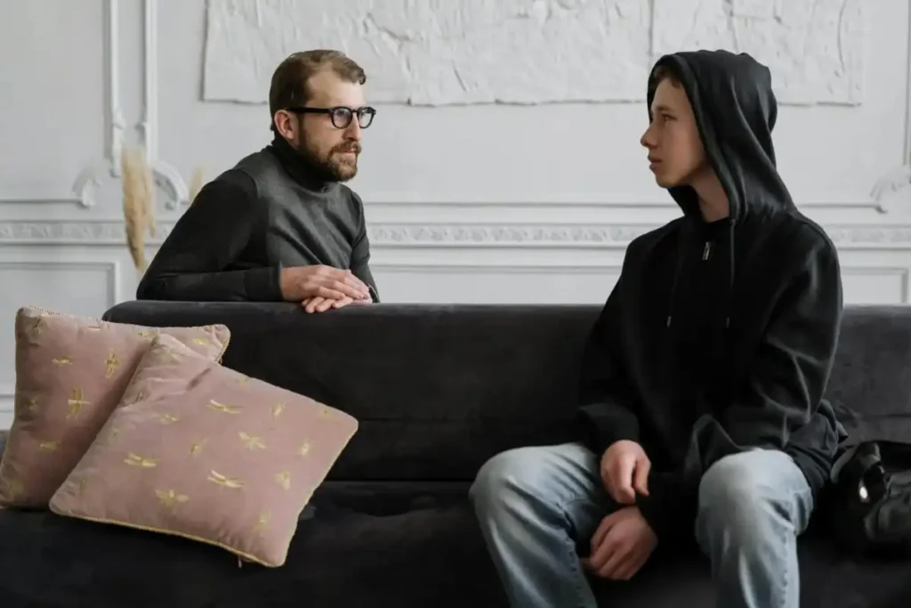 young man and a psychologist during one on one counseling