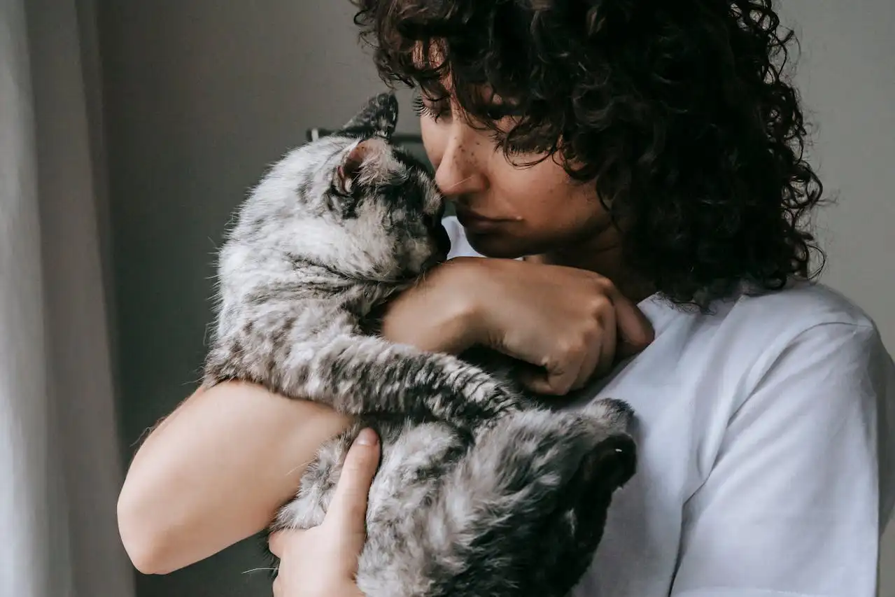 Curly woman with charming cat