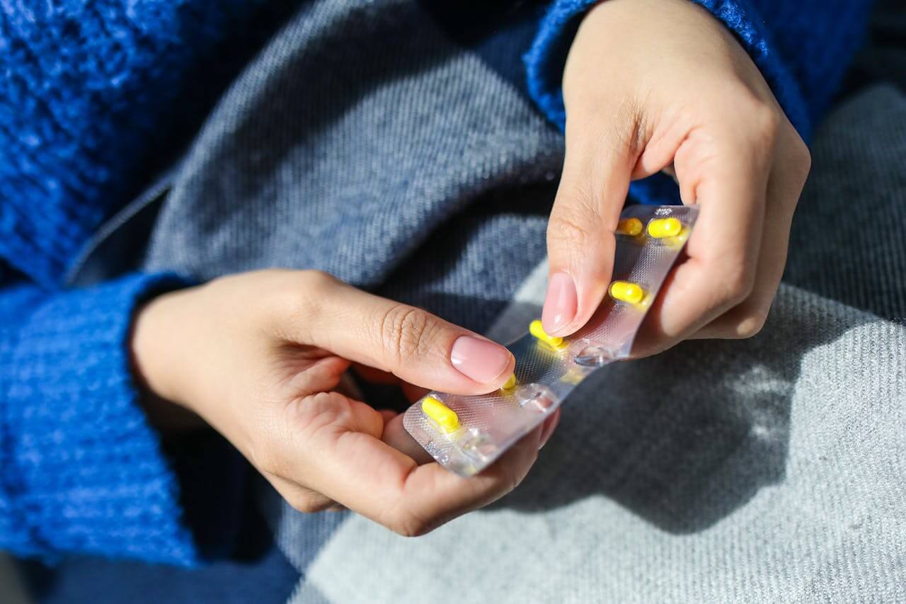 a female hands holding medicine