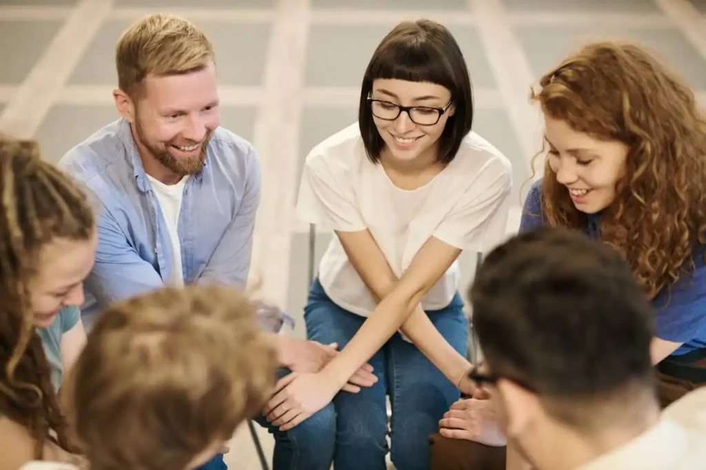 men and women during group therapy in addiction treatment center in corona california