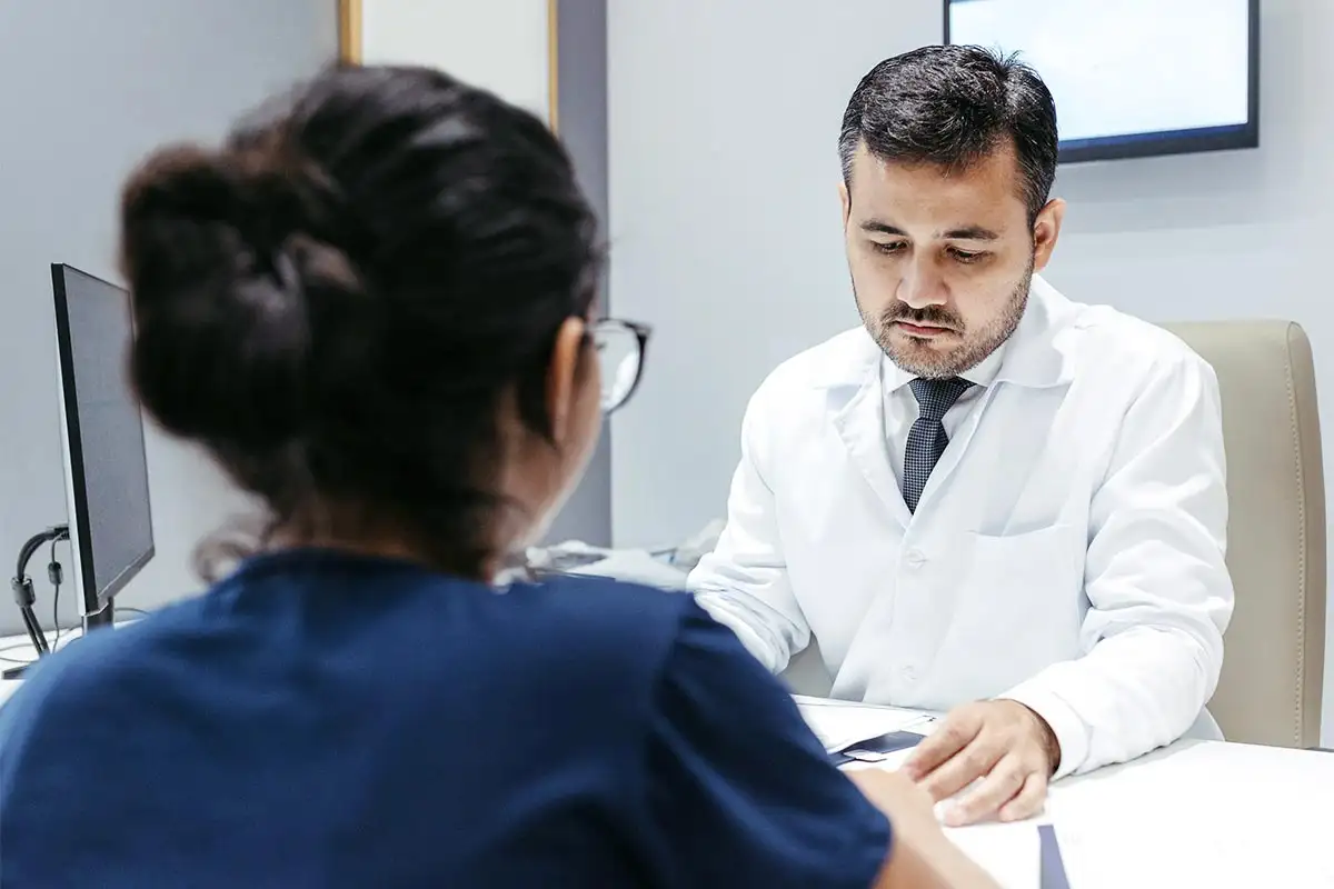 A doctor discusses detoxification with a patient in a Southern California drug and alcohol detox center office