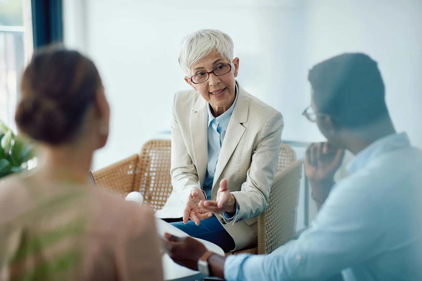 a man and a woman together with a female therapist discussing treatment in drug and alcohol rehab in corona california