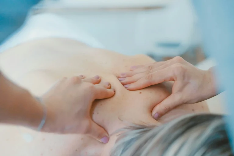 a woman getting massage to reduce pain