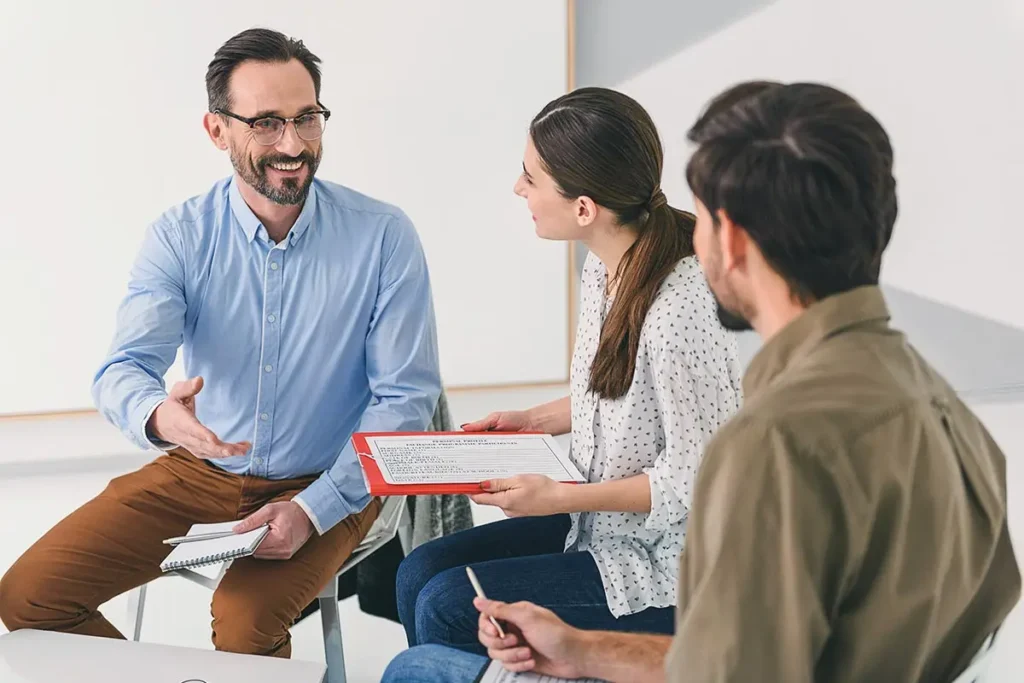 men and a woman during group therapy in drug rehab in corona california