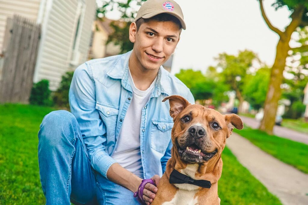 young man with his pet outside a drug and alcohol rehab center