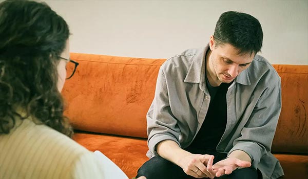 a man consulting a mental health expert about an intervention