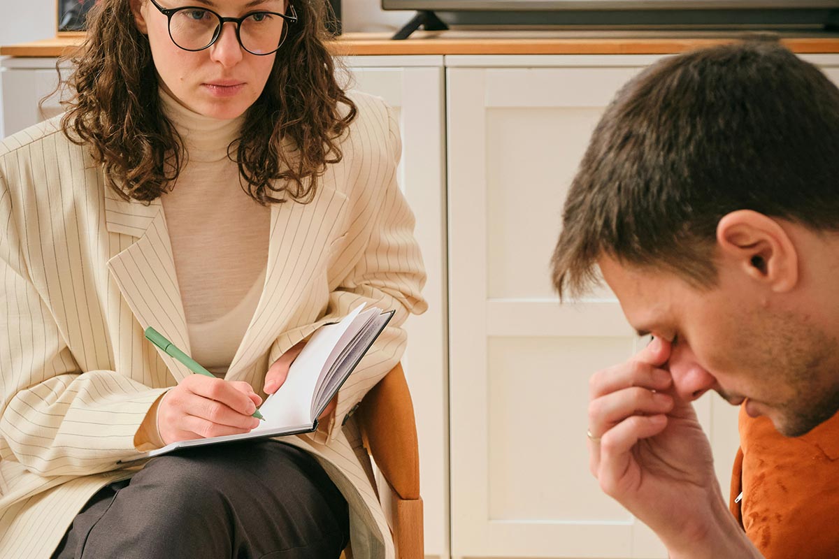 a man and his female psychologist during drug addiction treatment in california