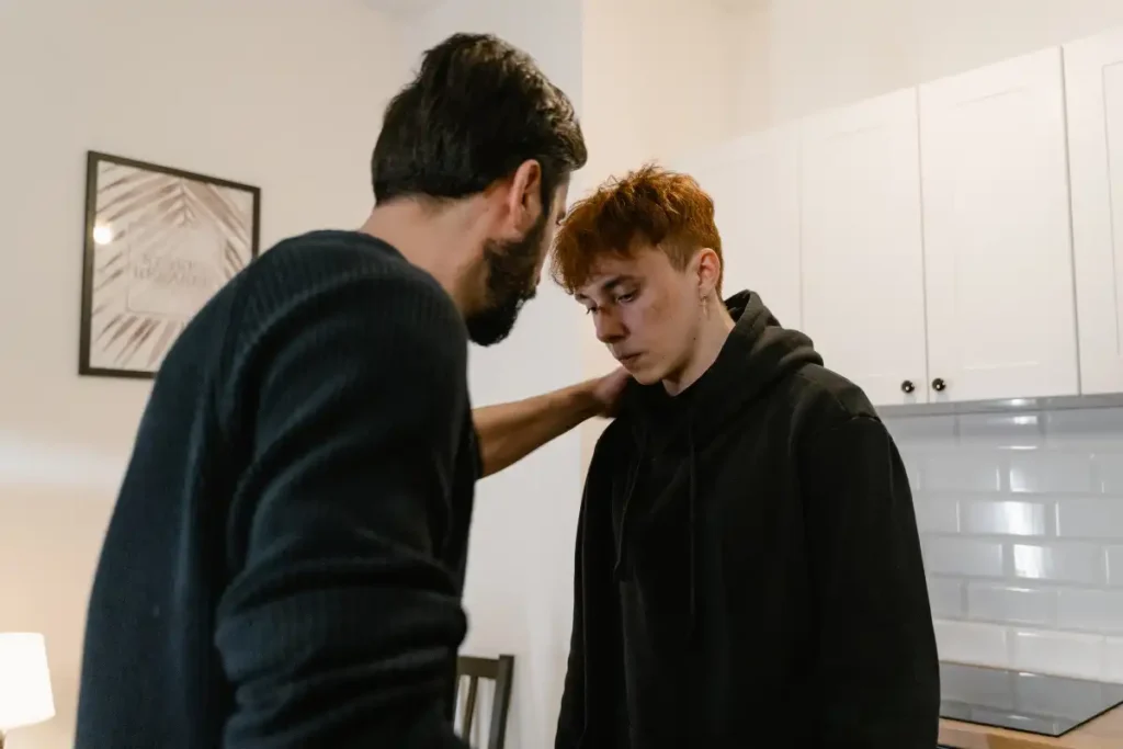 a male explaining to his loved one that he supports his recovery but setting boundaries