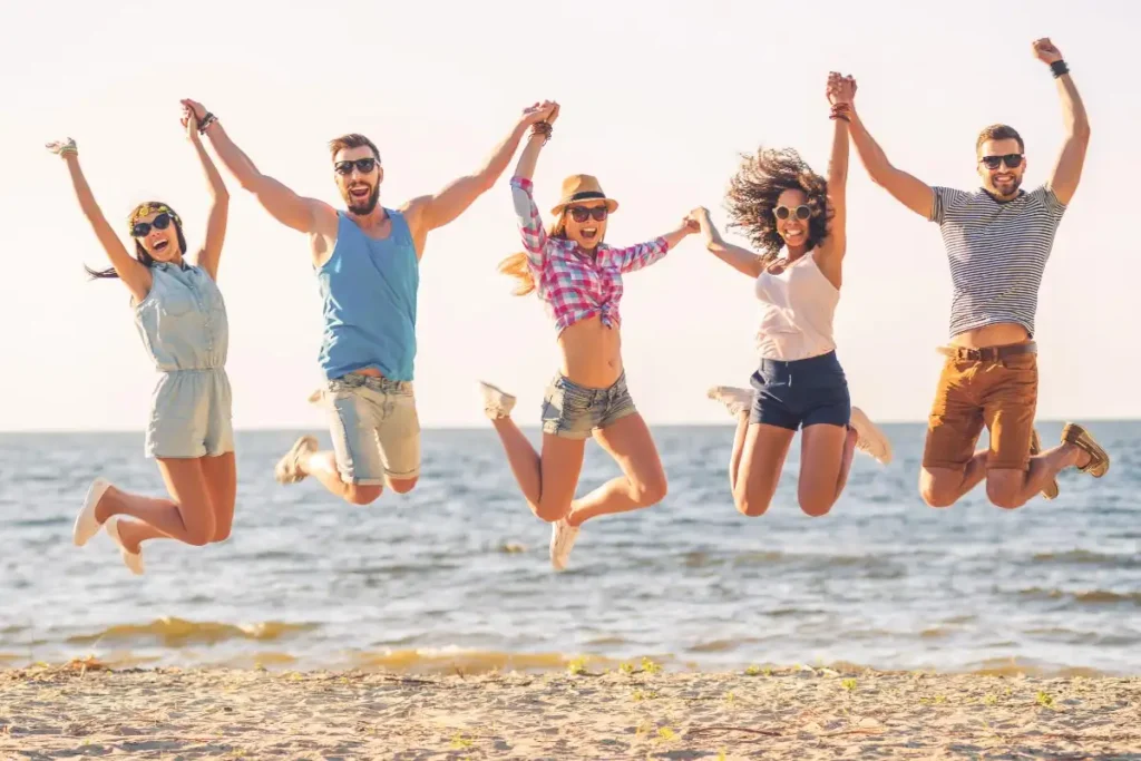 men and women doing jump shot enjoying summer during recovery