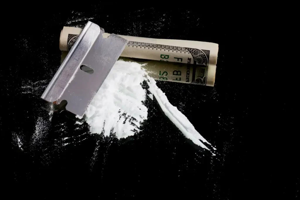 Cocaine and Razor Blade with Rolled $100 Bill (1)