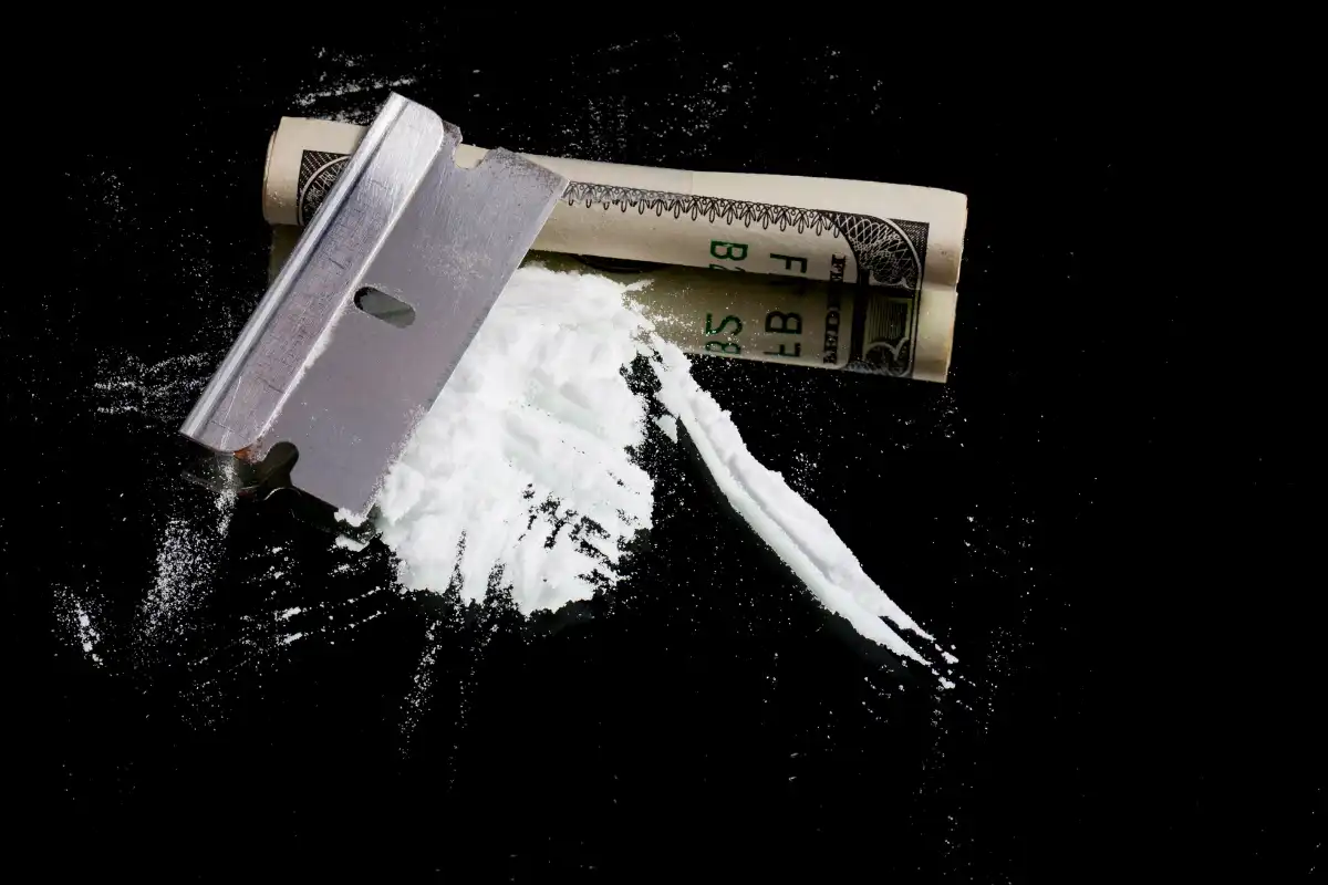 Cocaine and Razor Blade with Rolled $100 Bill (1)