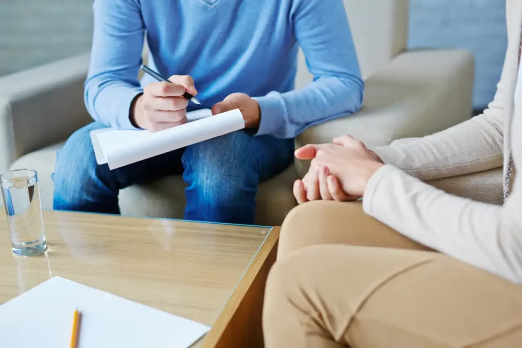 a client and a psychologist during psychotherapy