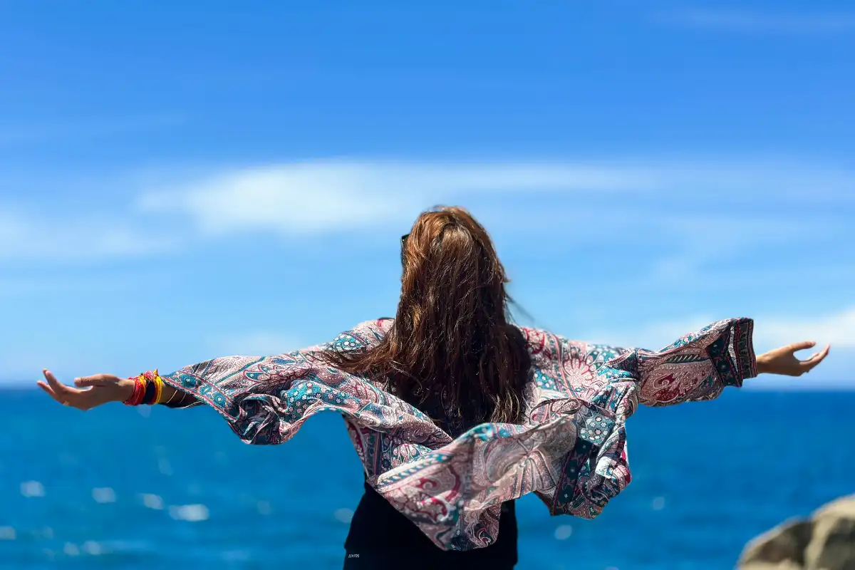 Woman enjoying the warm weather in the ocean