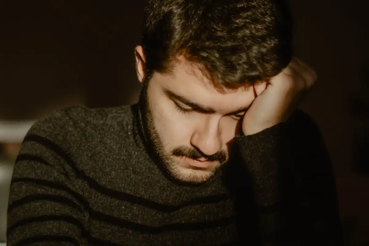 a man wearing black sweater alone and lonely