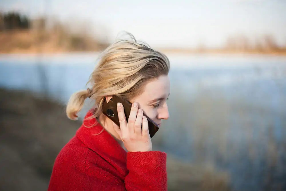 a woman talking on the phone checking on her friend