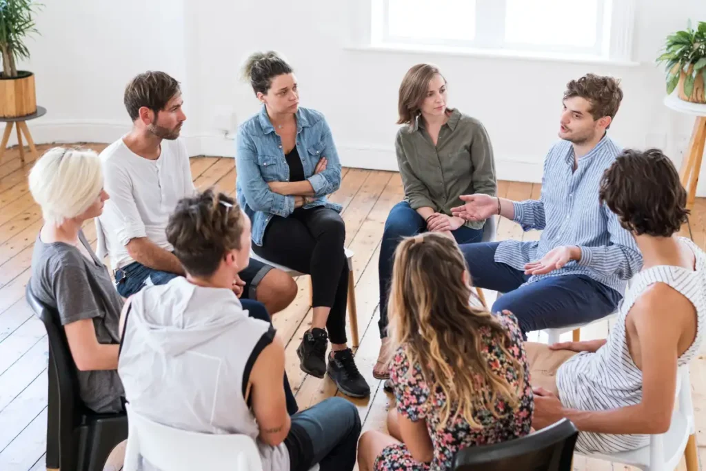 man talking in a group therapy