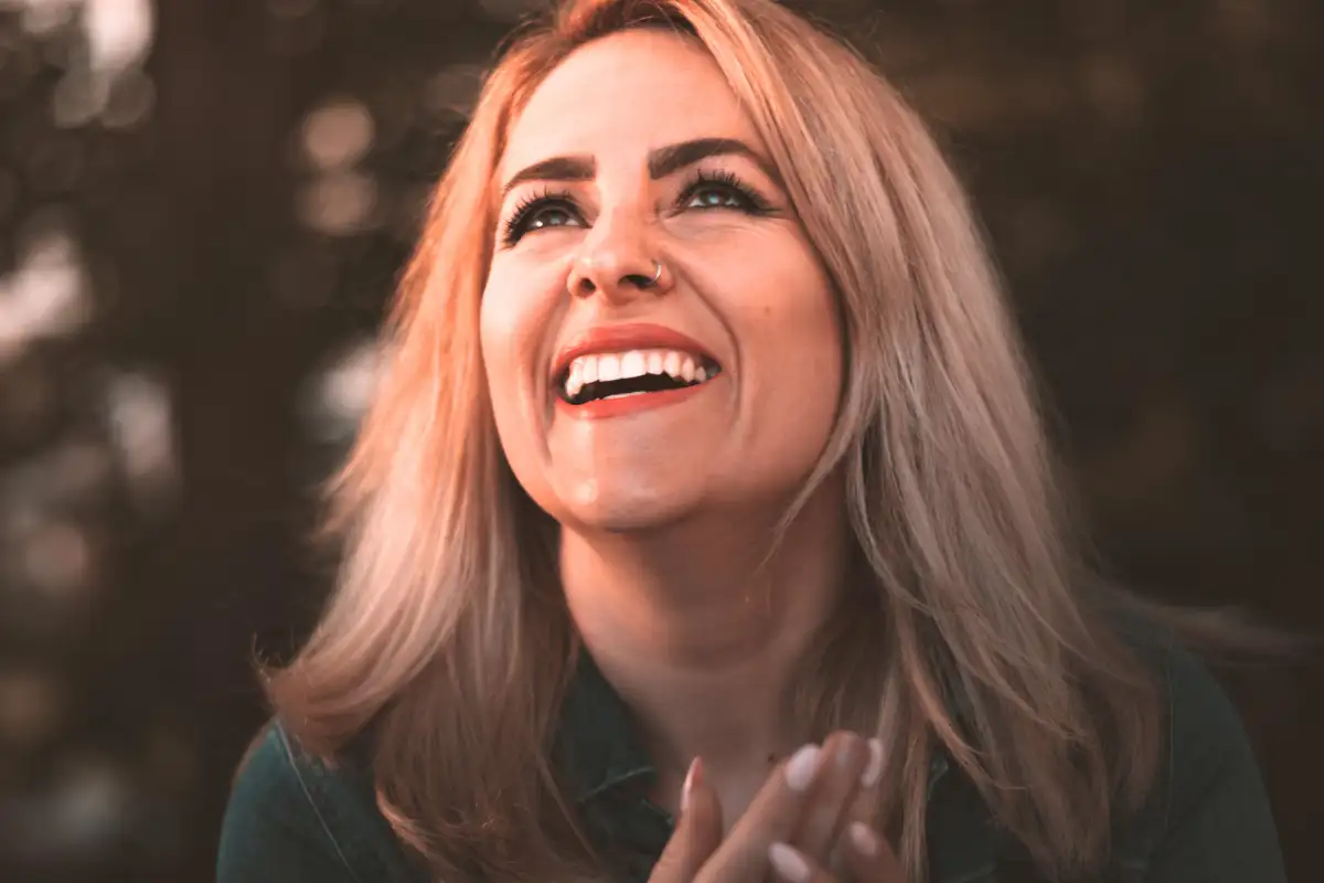 A Woman in Denim Jacket Smiling