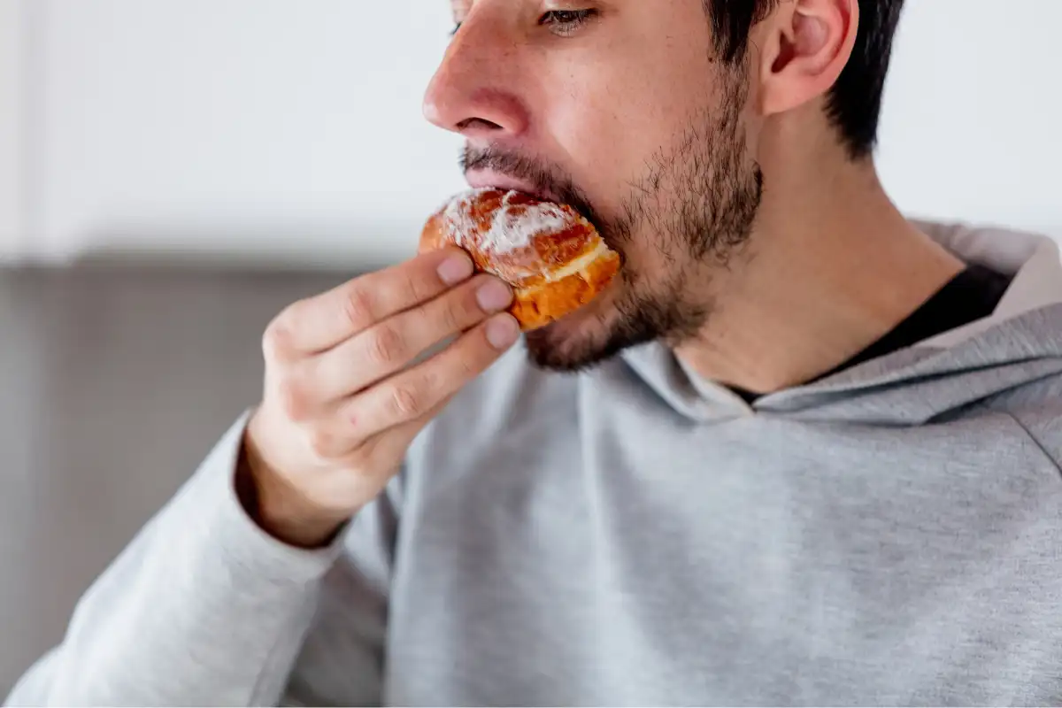 a man eating donut