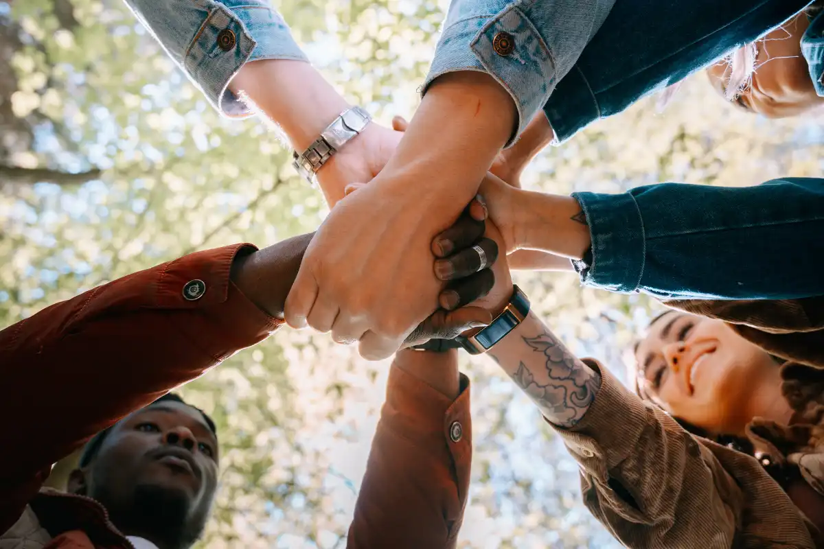 A Group of Friends Hands Together in Unison
