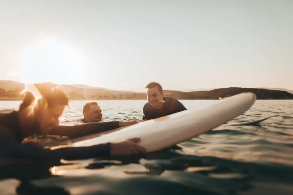 Friends surfing in the ocean