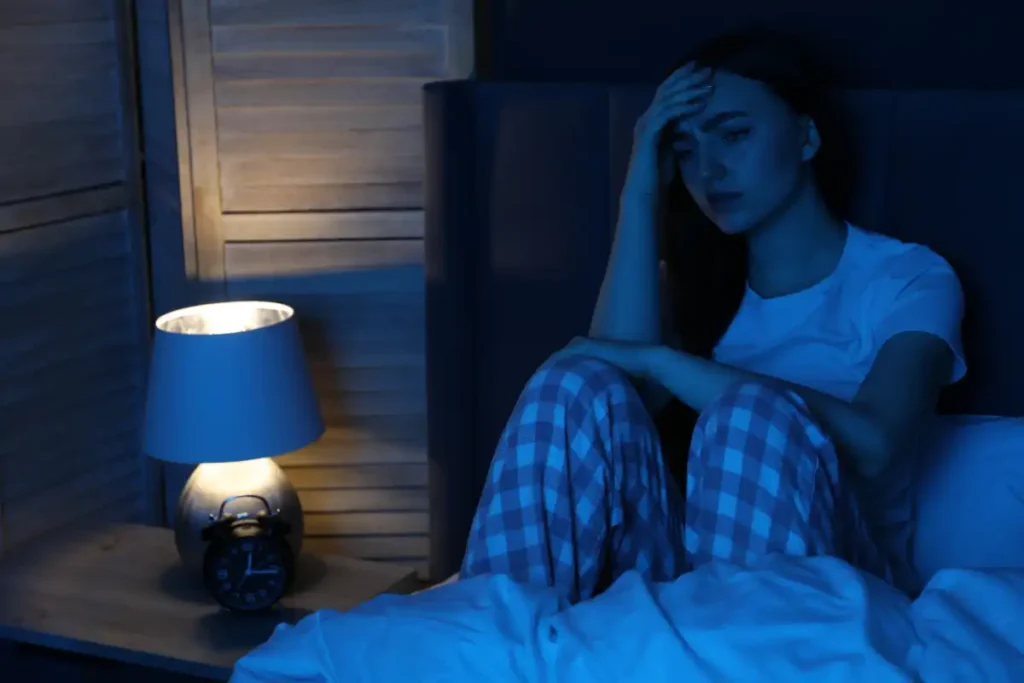 Frustrated Woman Suffering from Insomnia on Bed at Home