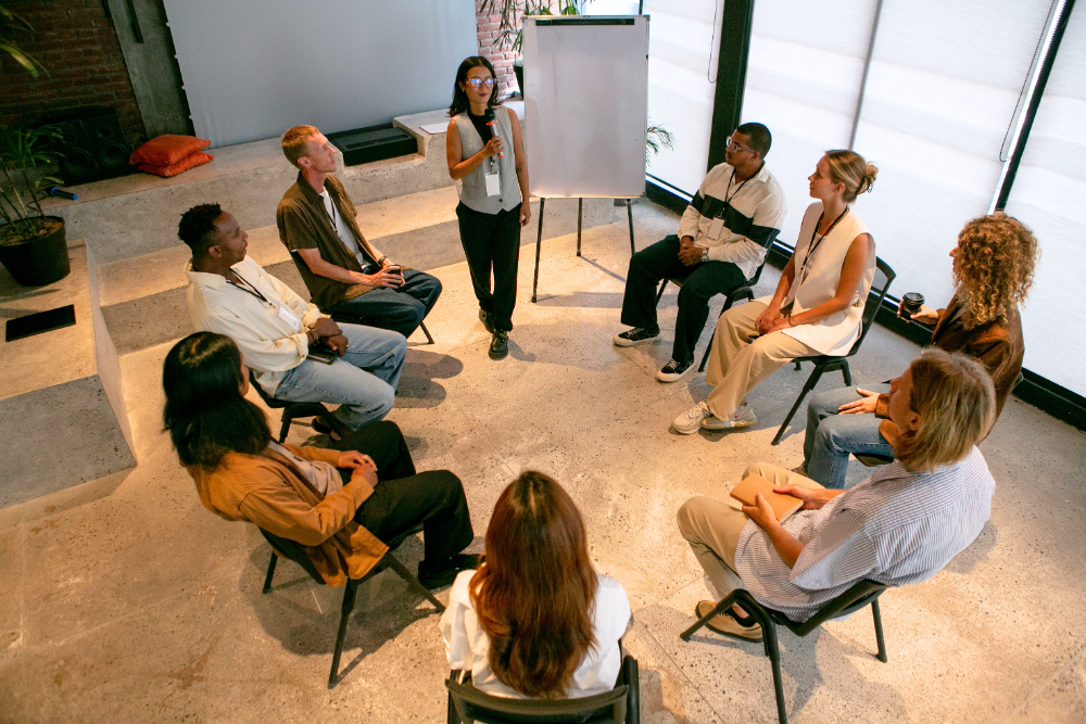 men and women in a group therapy