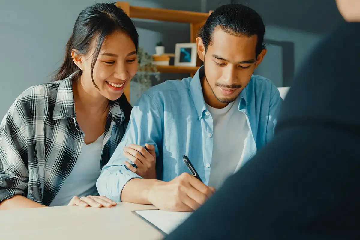 a couple signing the Assistance with FMLA and Short-Term Disability Paperwork for Treatment