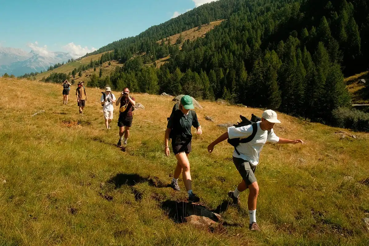 a group of men and women hiking