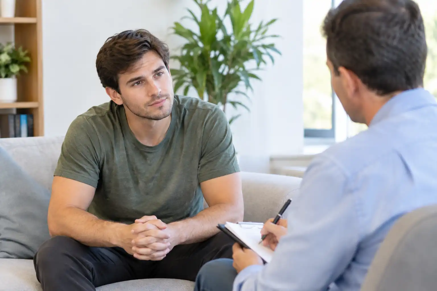 photo of a man during one on one counseling in drug rehab together with a psychologist